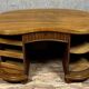 Art Nouveau period bean-shaped oak and walnut center desk