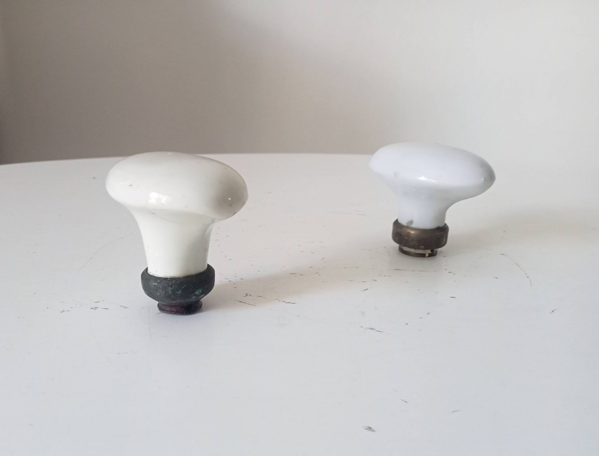 Pair of antique oval door handles in porcelain and brass.
