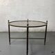Round coffee table in brass and smoked glass