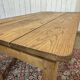 Extendable oak table from the 1930s with Gothic decoration.