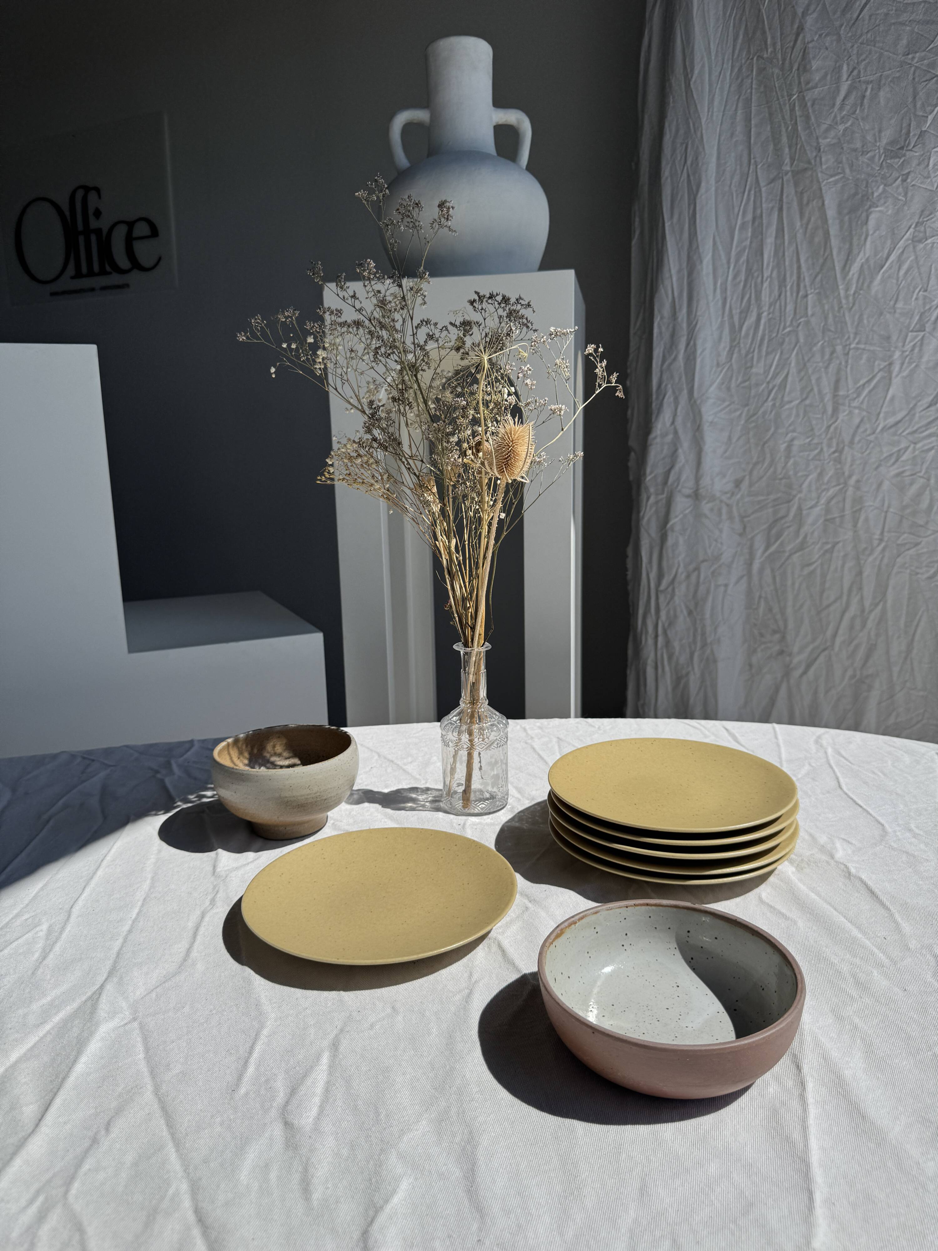 A speckled grey interior bowl with a matte brown exterior H5 D15