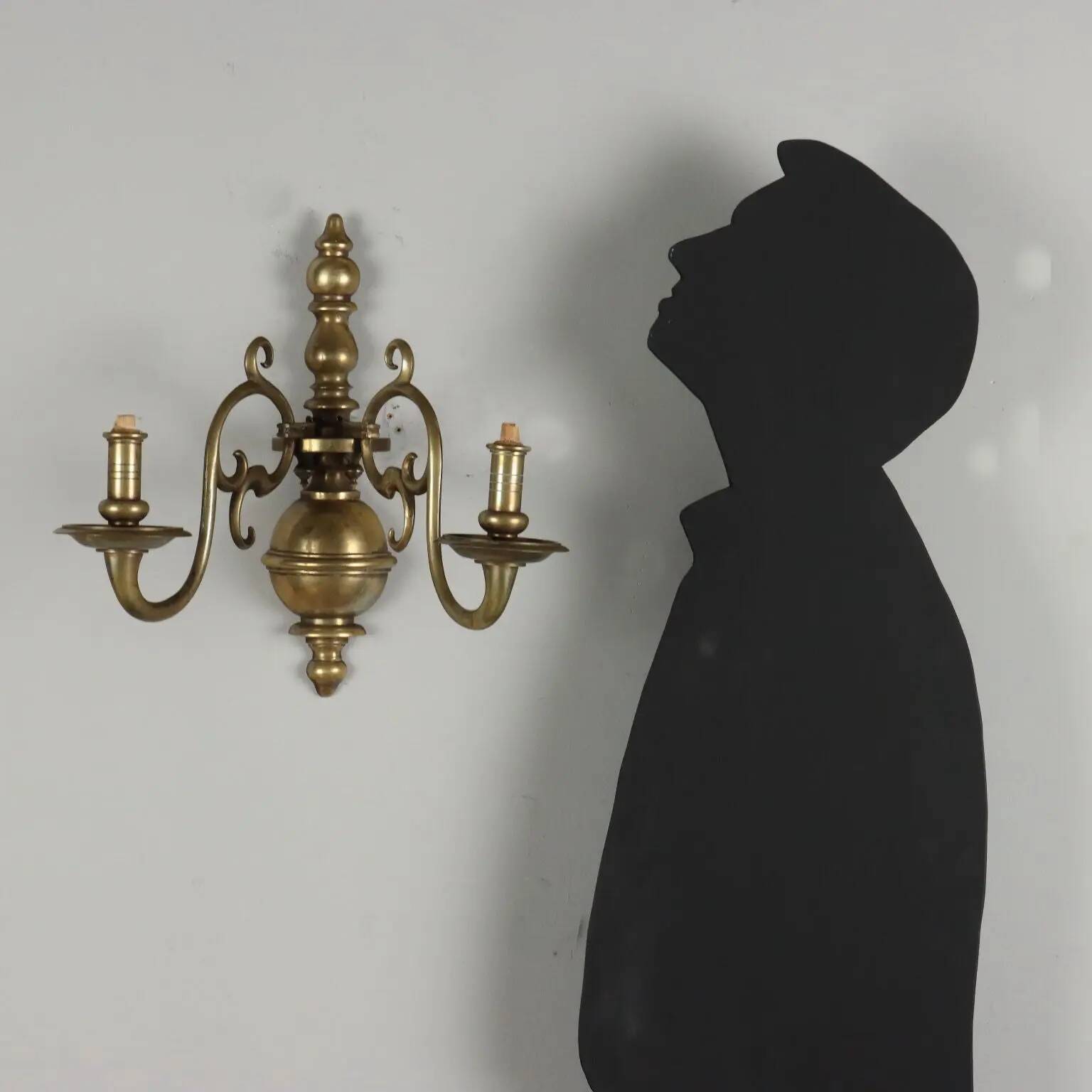 Pair of antique wall sconces in 20th-century Baroque style.