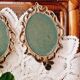 2 frames in gilded metal and curved glass
