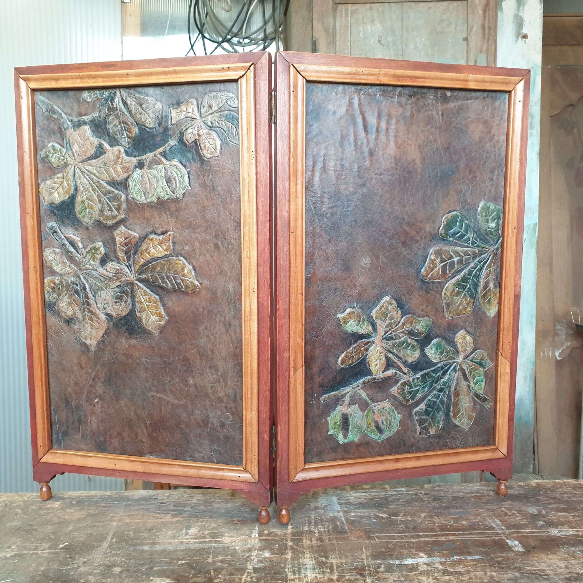 By fire art-nouveau in wood, embossed leather and fabric