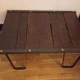 Raw wood and wrought iron coffee table