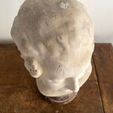 Plaster bust on marble stand