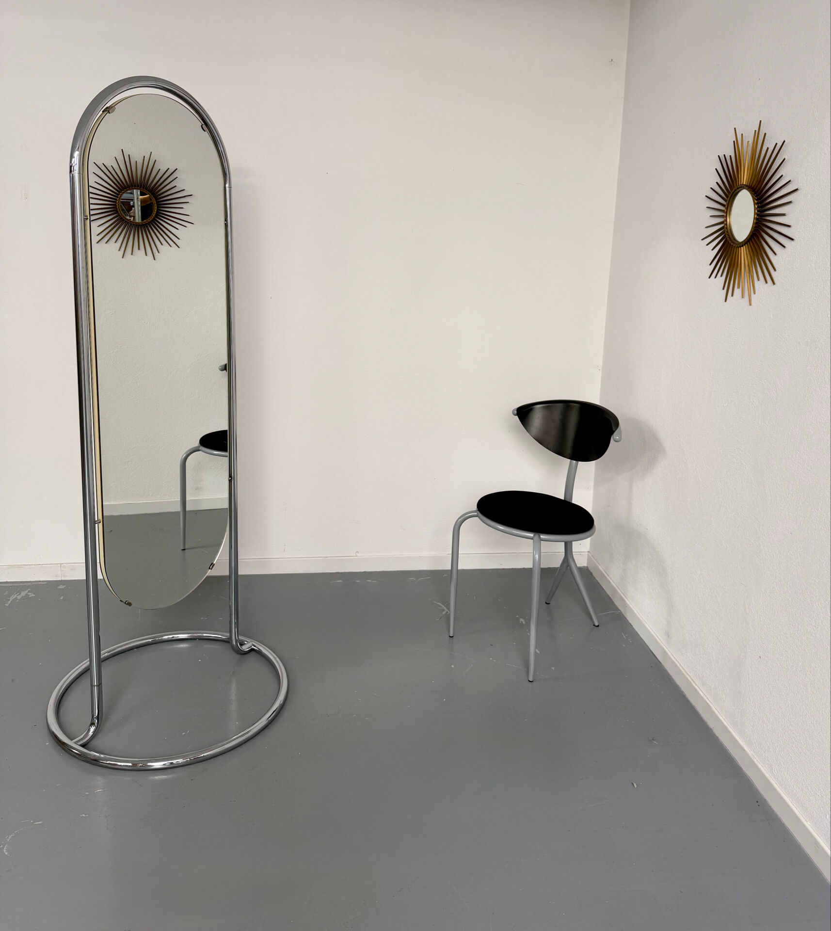 Large freestanding chrome metal full-length mirror in 1970s design.
