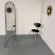 Large freestanding chrome metal full-length mirror in 1970s design.