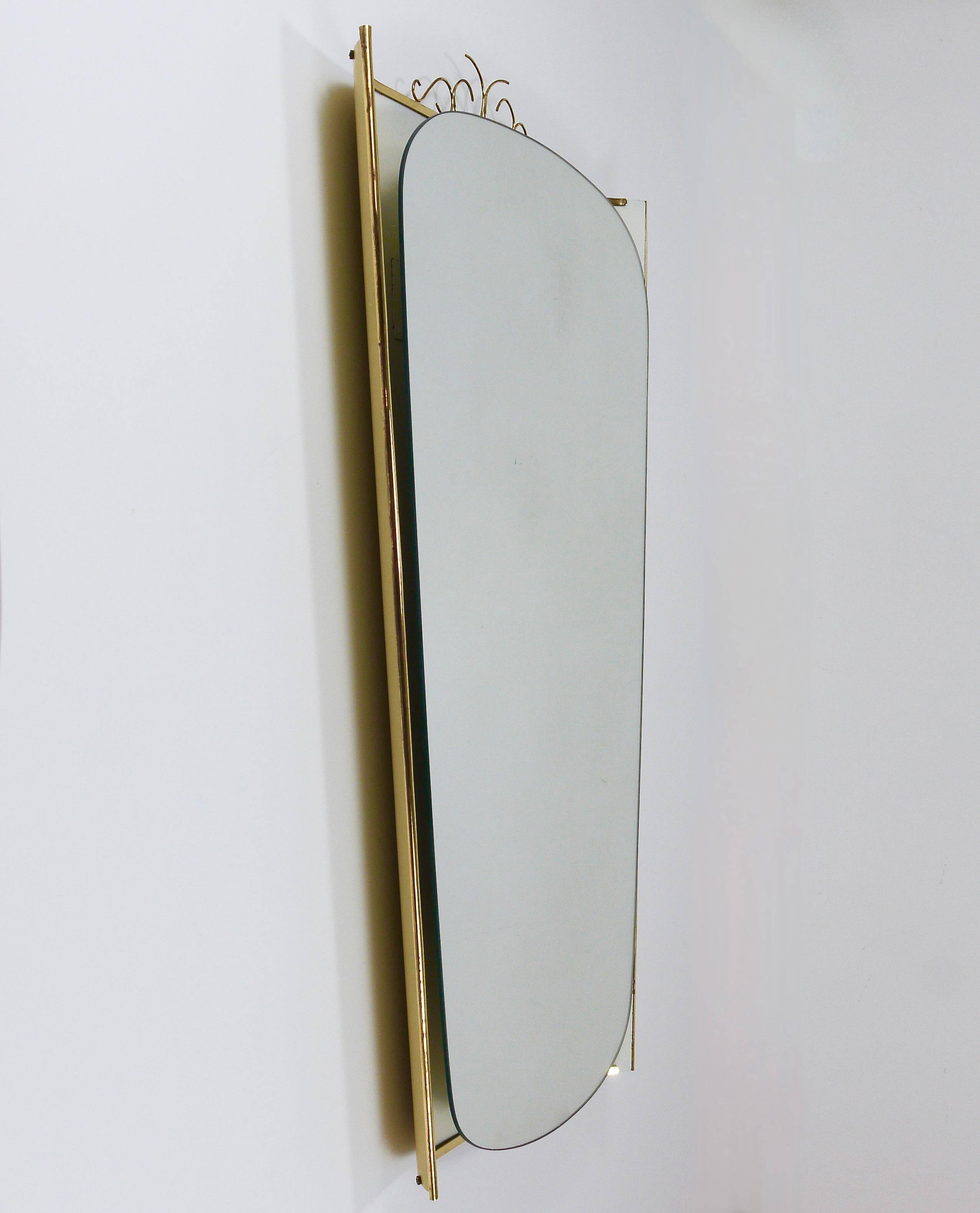 Mid-century illuminated wall mirror by Ernest Igl with brass crown, by Hillebrand.