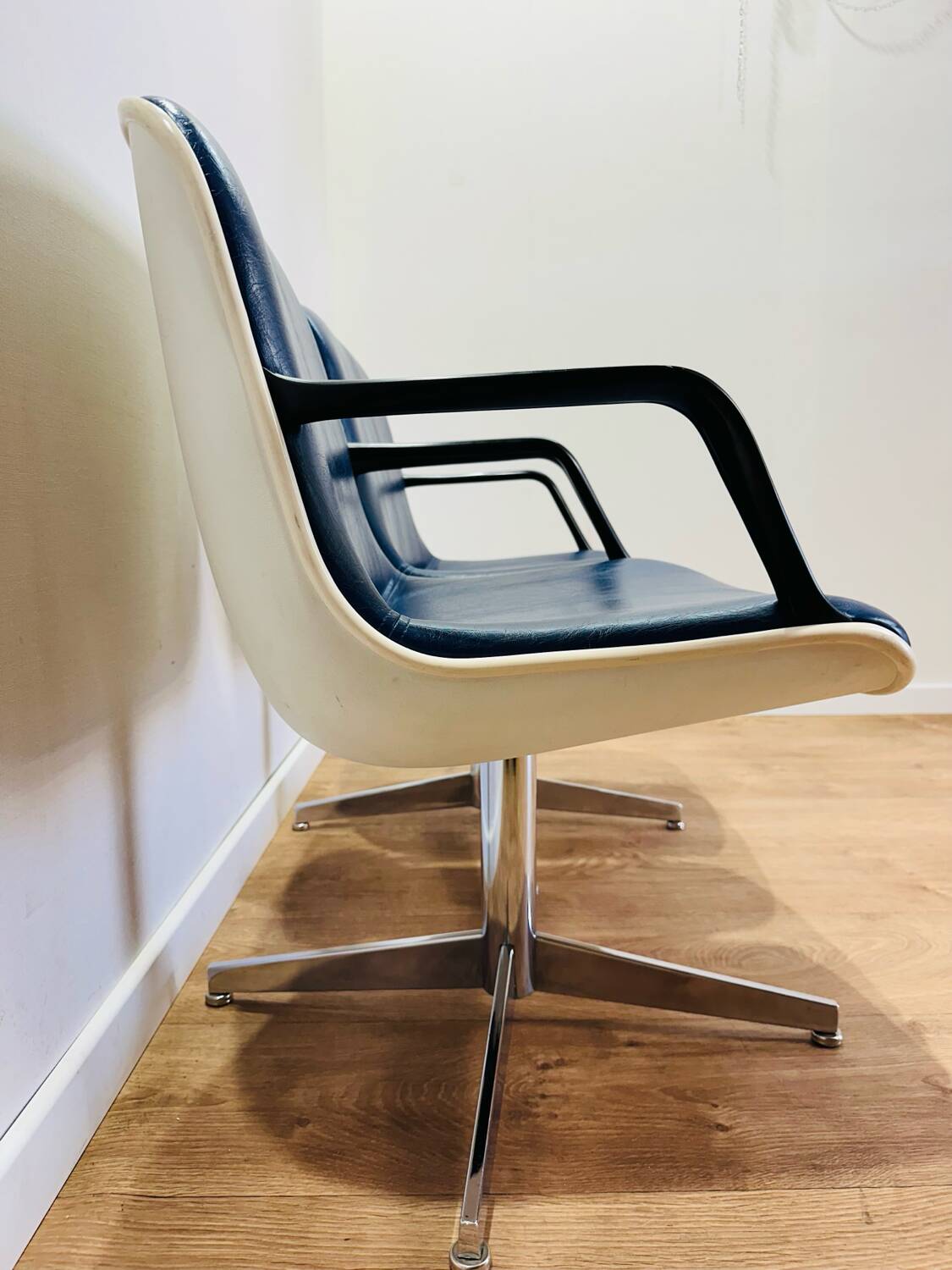 2 office chairs attr. to Strafor, white molded plastic shell, blue skai and chrome metal star base