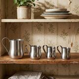 Set of 4 vintage bar measures in brushed stainless steel from the 60s-70s.