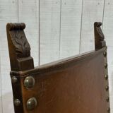 High-backed chair from the early 20th century in oak and leather