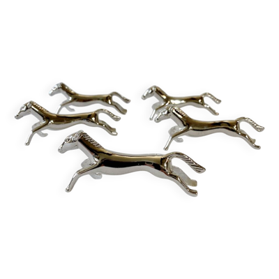 5 porte-couteaux en métal argenté en forme de cheval. Années 1960