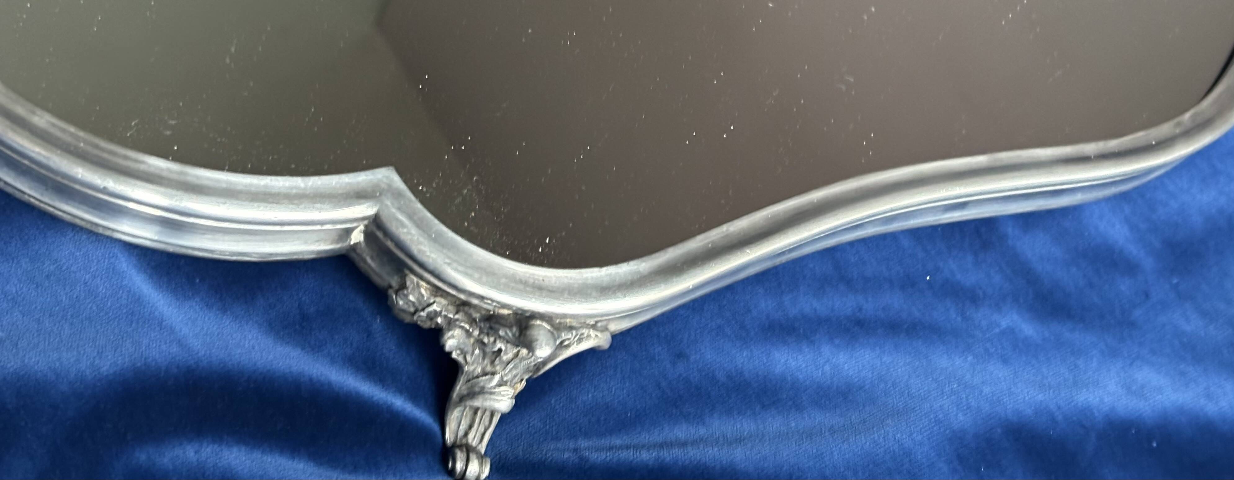 19th century mirror and silver table centrepiece