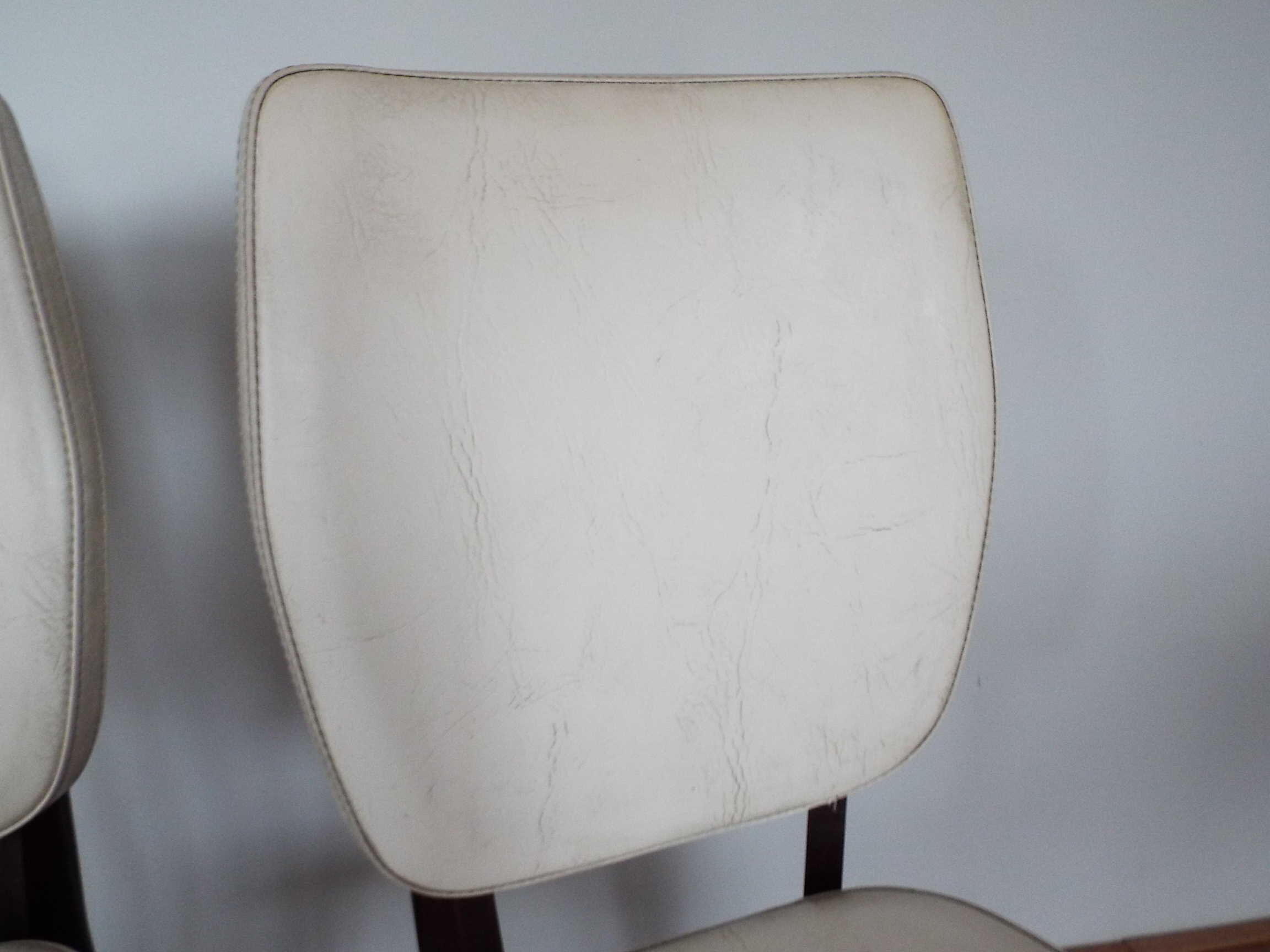 2 skai and wooden chairs