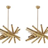 Pair of matte gold-plated brass chandeliers. Italian work from the 1970s.