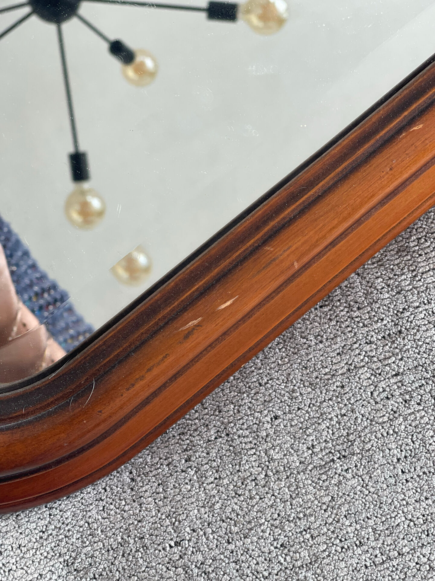 Vintage wooden framed mirror with bevelled glass.