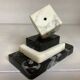 A marble dice bookend