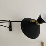 Articulated light in brass