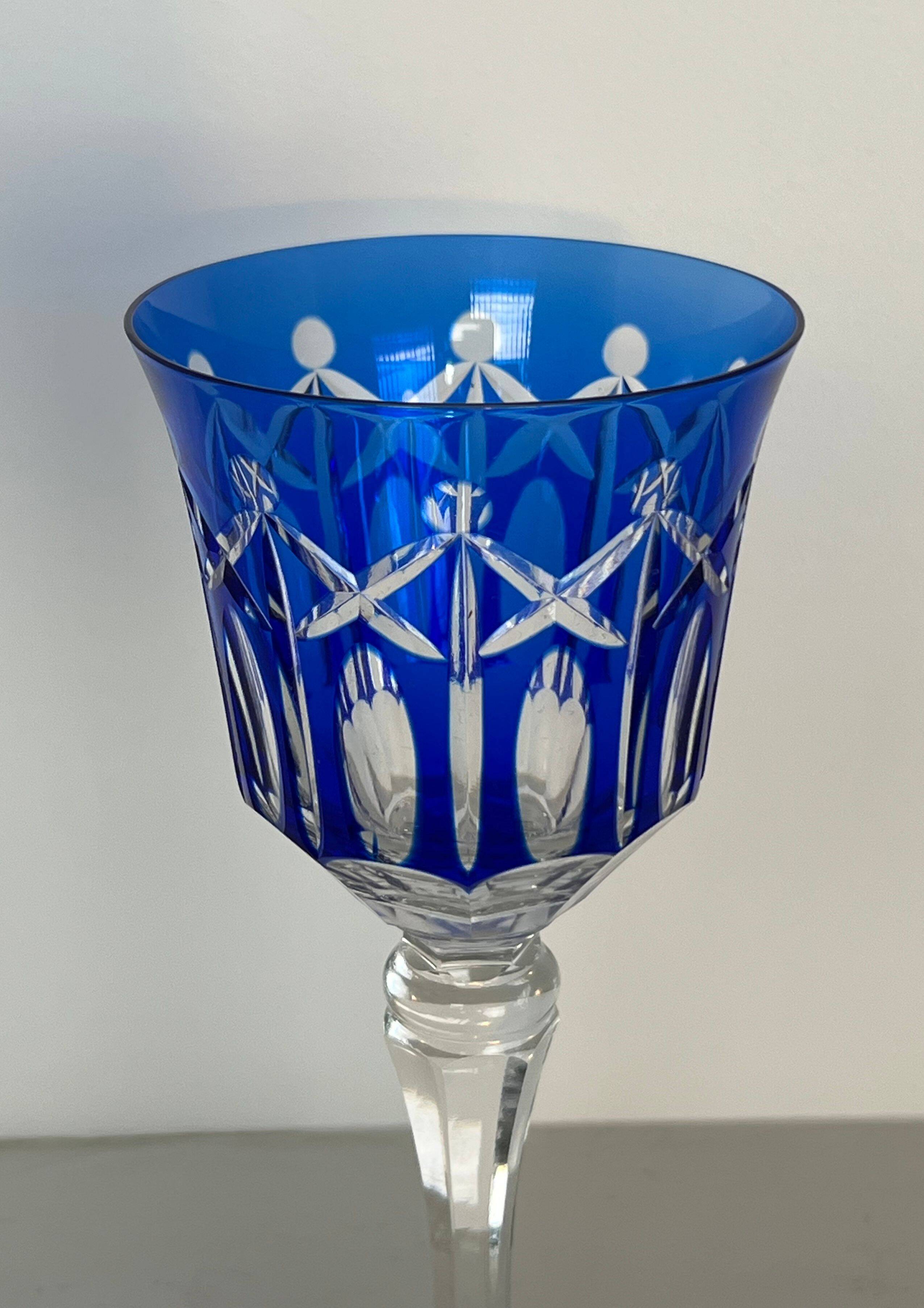 Set of twelve glasses in crystal tinted in different colours and cut with stars.