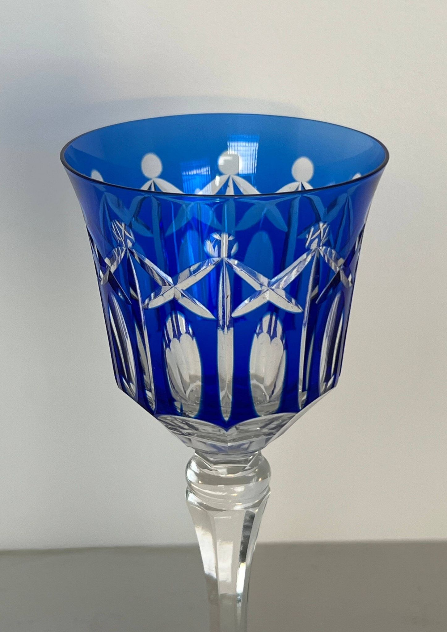 Set of twelve glasses in crystal tinted in different colours and cut with stars.