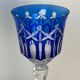 Set of twelve glasses in crystal tinted in different colours and cut with stars.