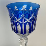 Set of twelve glasses in crystal tinted in different colours and cut with stars.