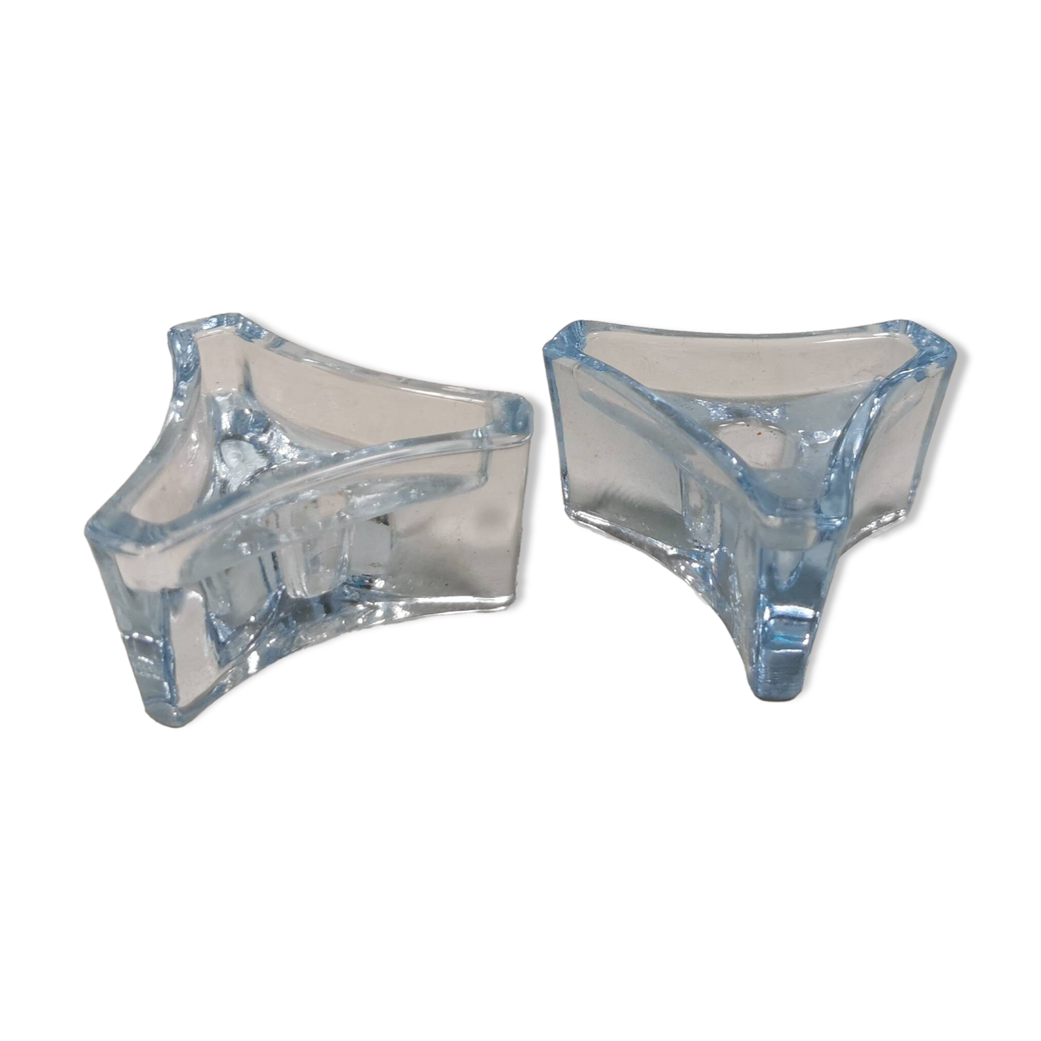 Two beautiful glass candle holders in translucent bluish glass.