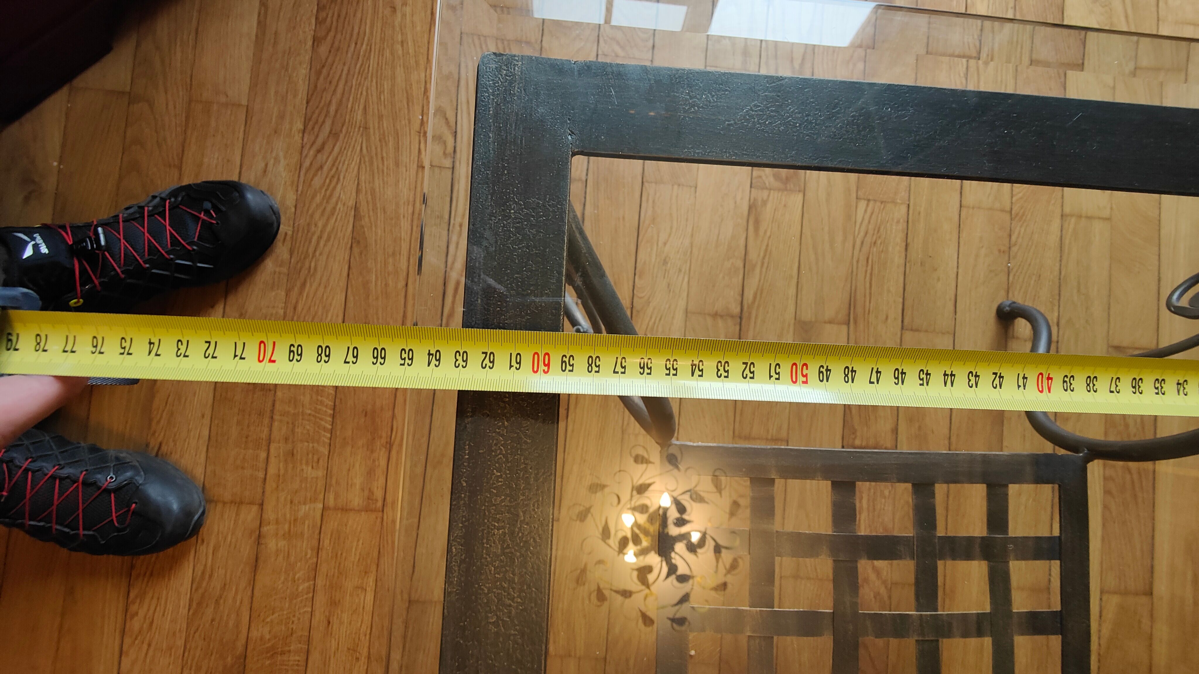 Black wrought iron coffee table and Roche Bobois glass top