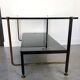 Modernist coffee table in metal tubular base and glass top 1950