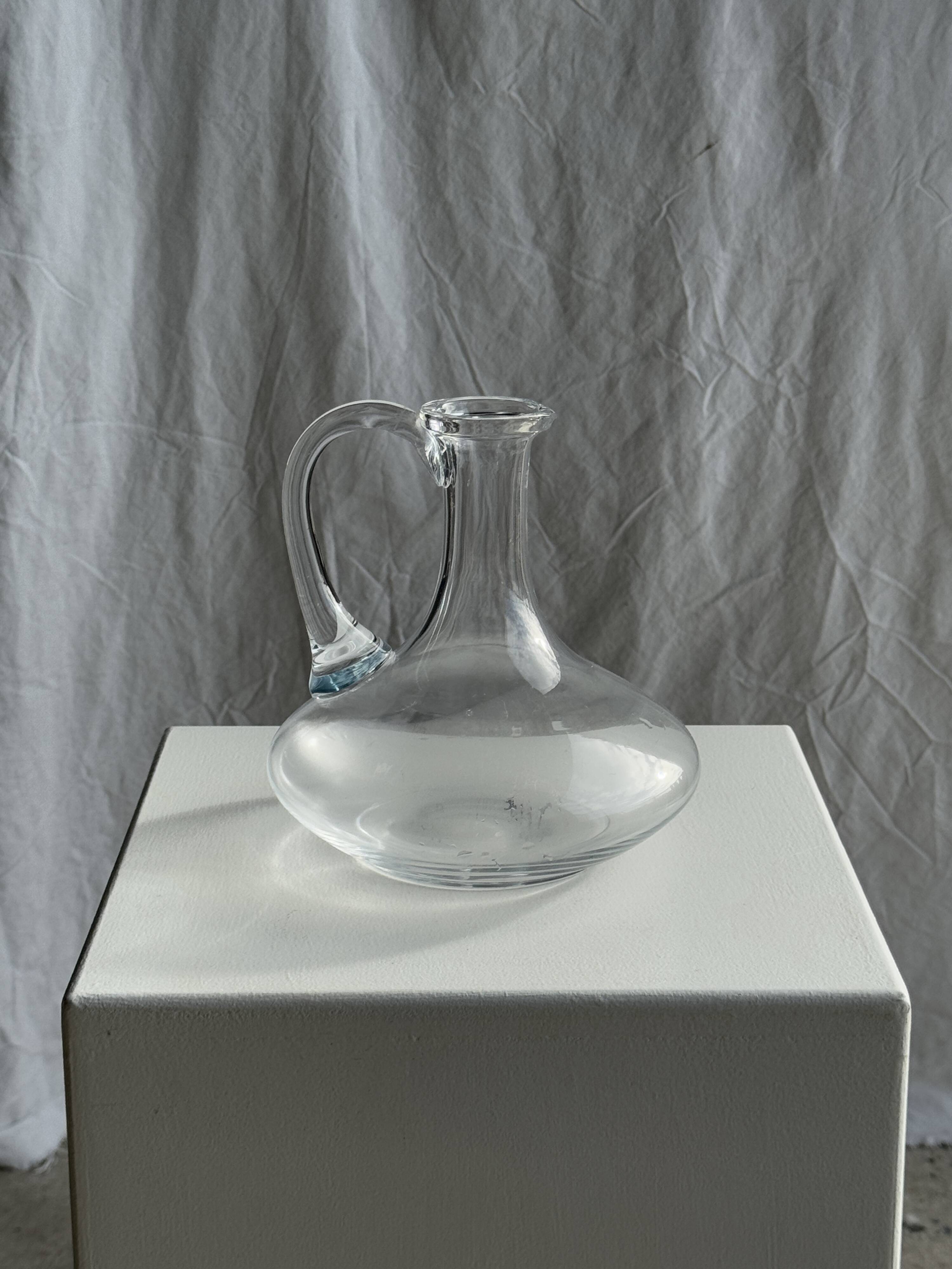 Vintage glass carafe with flattened flared belly handle H18