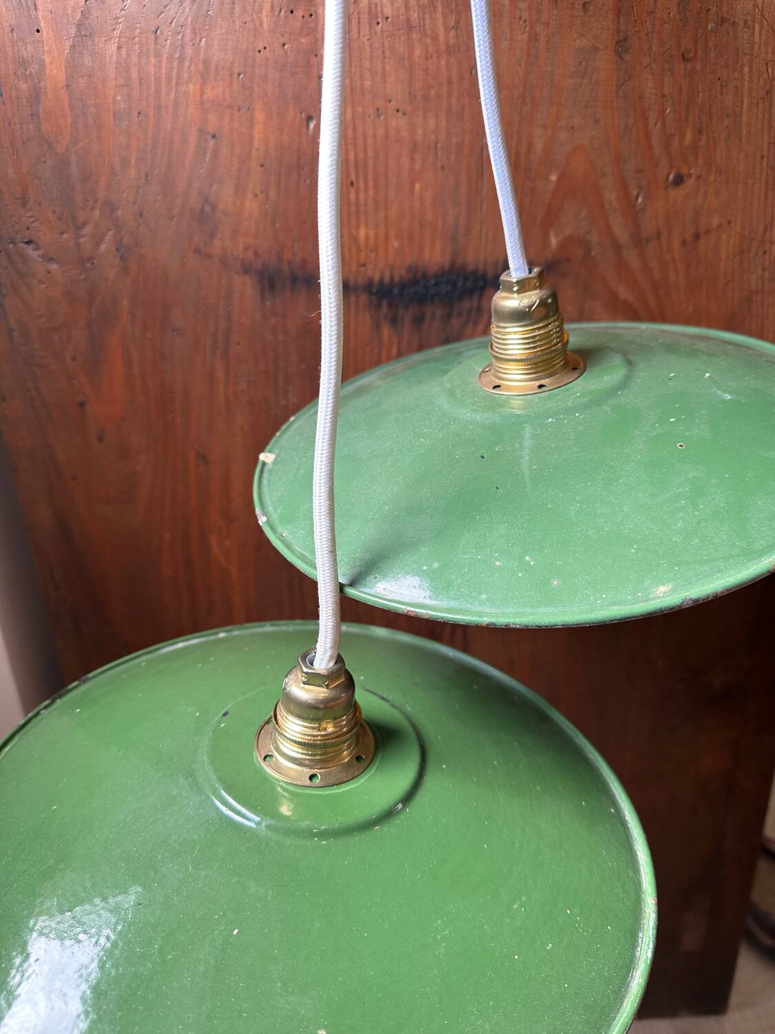 Set of two vintage green and white enamelled sheet metal lampshade pendants