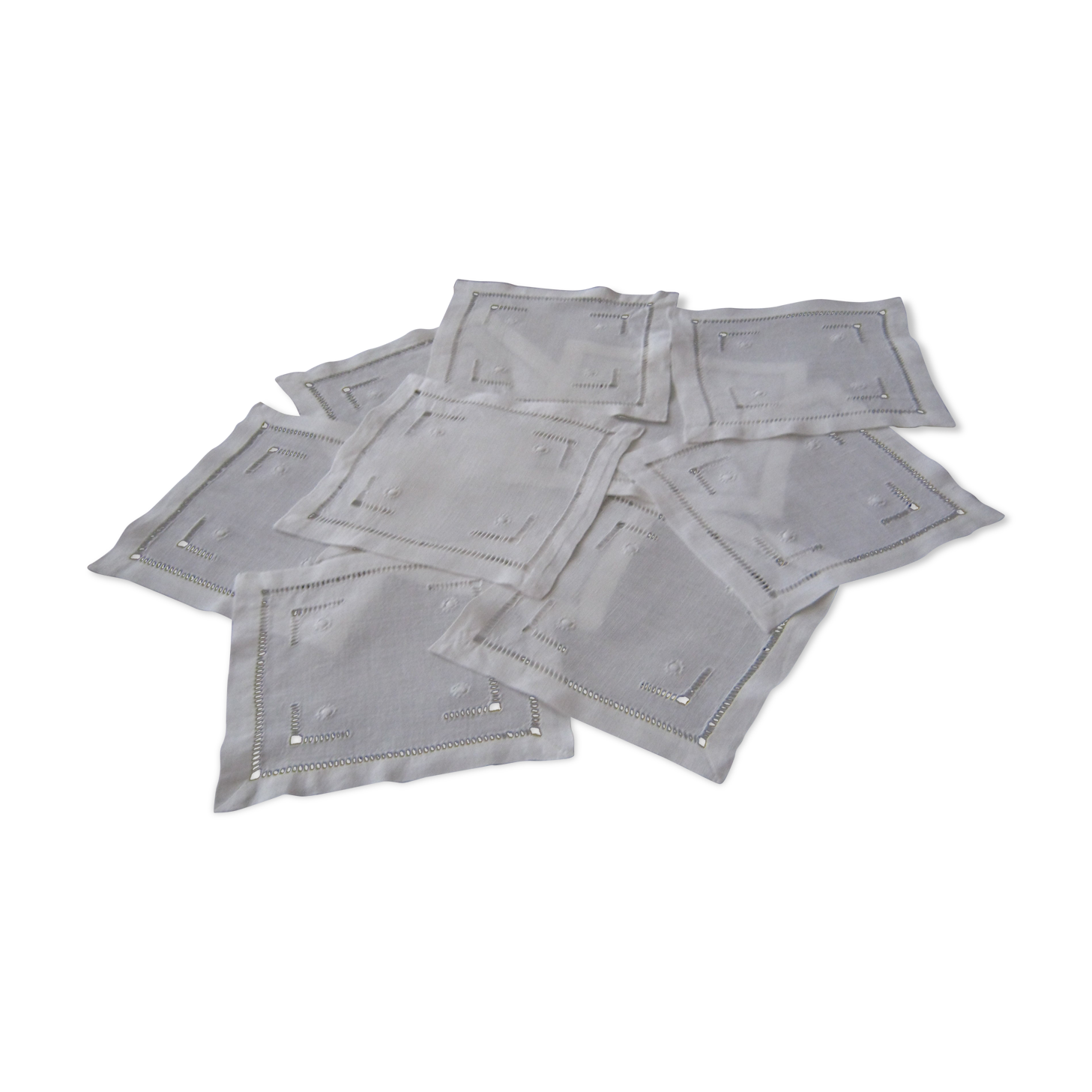 Under glass / small hand embroidered white cotton doilies