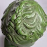 Bust of Eros in patinated plaster in imitation of bronze on wooden base