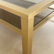 Table basse grand modèle en métal doré, France années 70