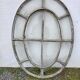 Bull's-eye window from the 19th century in iron (with opening).