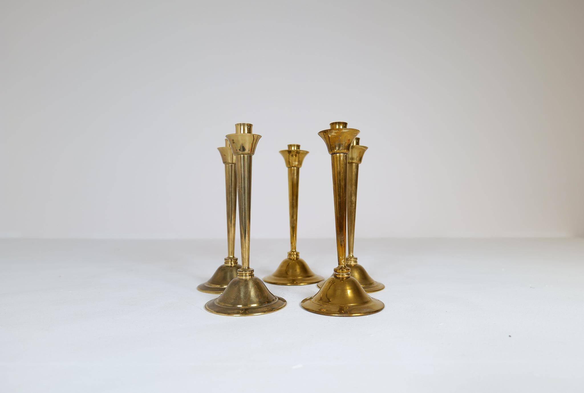 Mid-century set of 5 brass candlesticks by Lars Holmström, Arvika, Sweden.
