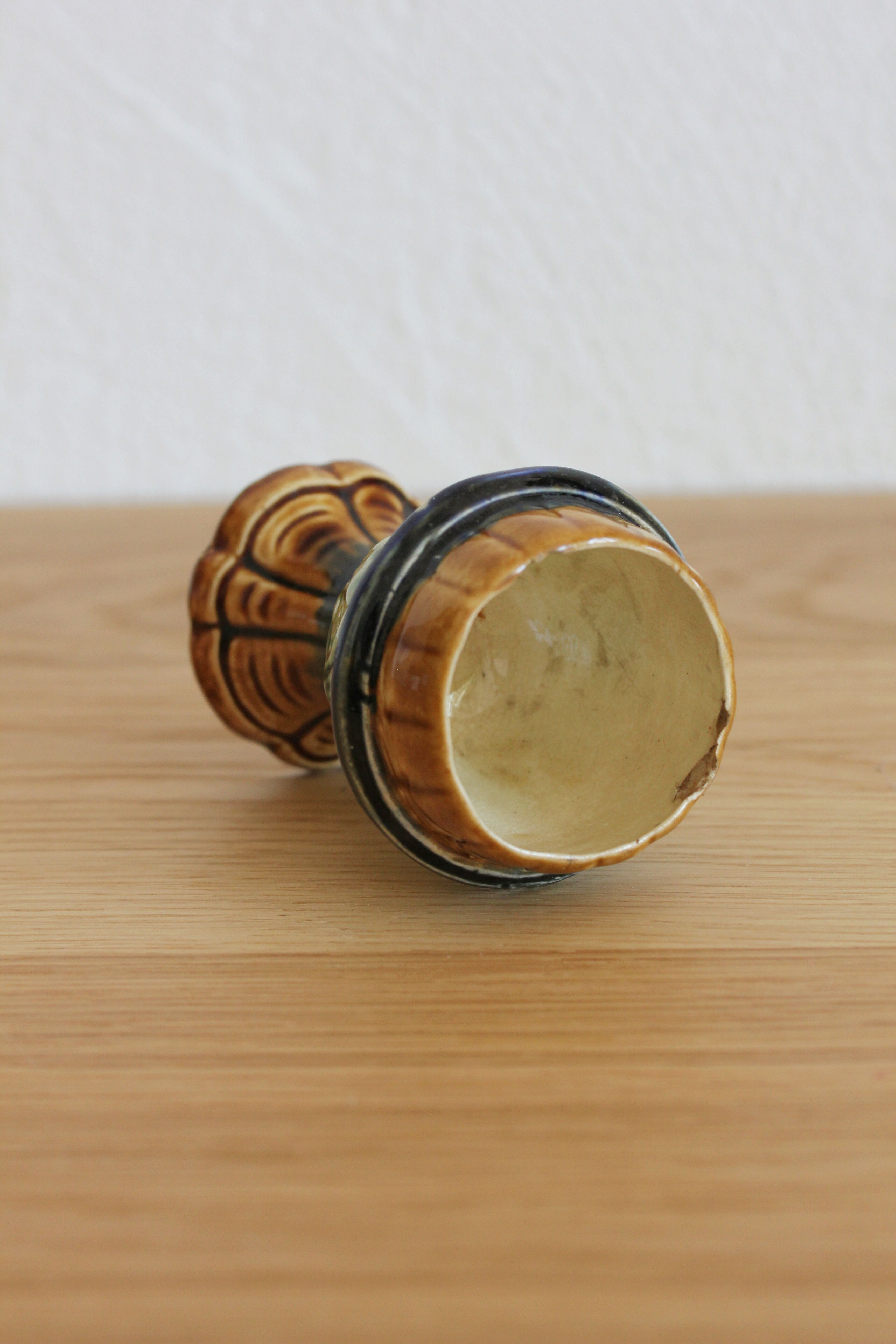 Late 19th-century earthenware egg cup in slipware