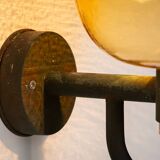 Pair of brass wall lamps with decorated amber coloured shades