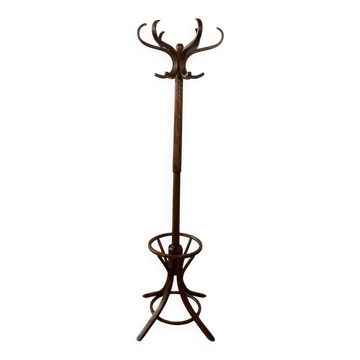 Antique curved wooden coat rack with umbrella stand.