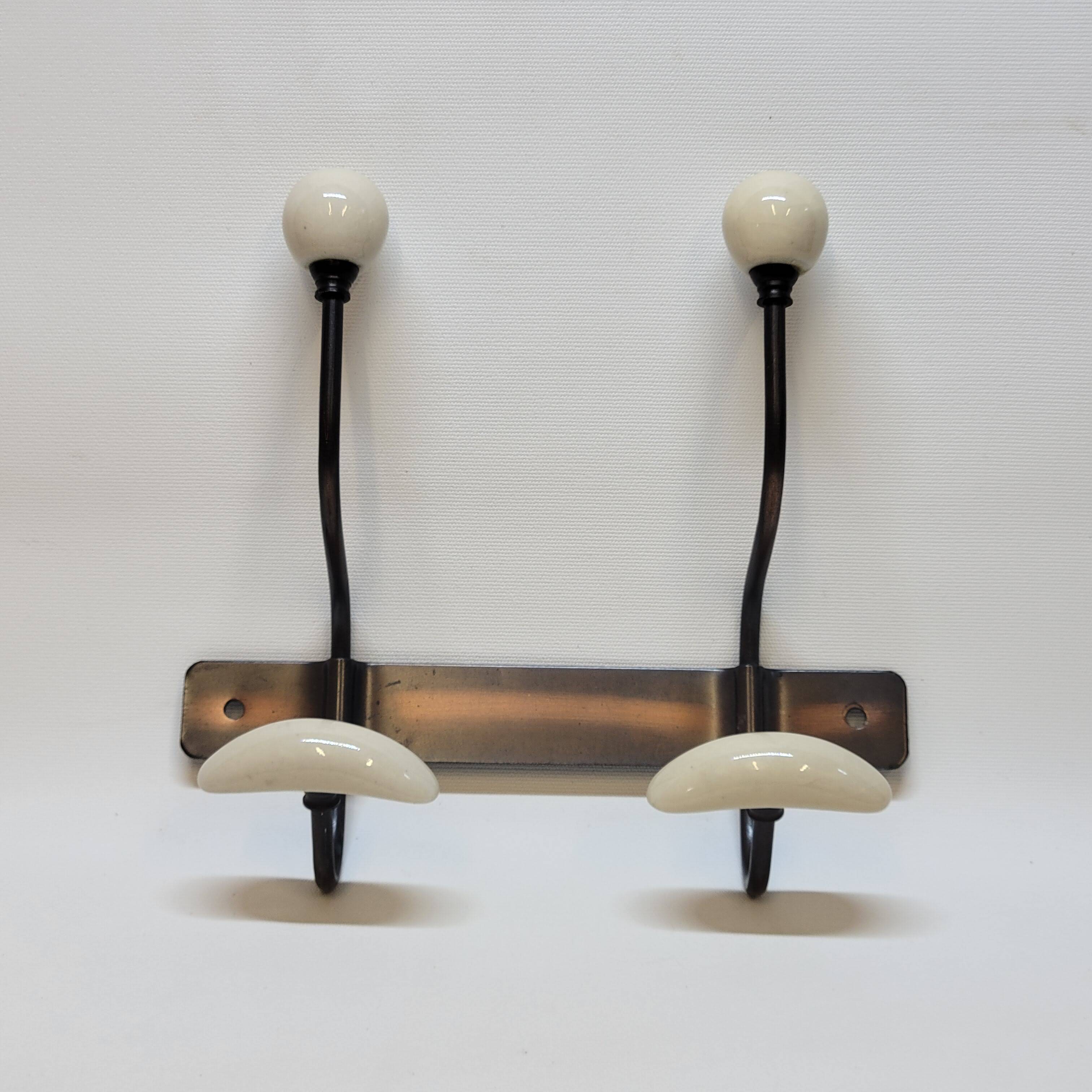 Wall coat rack in metal and porcelain with 2 hooks