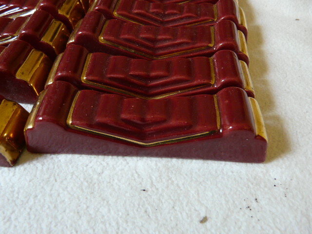 together 12 carries knives and a red enamelled earthenware bottle
