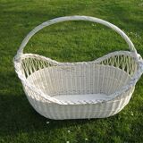 White wicker cradle basket