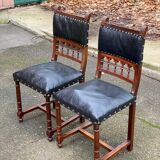 Two 19th-century Henri II chairs in solid wood and black leather upholstery