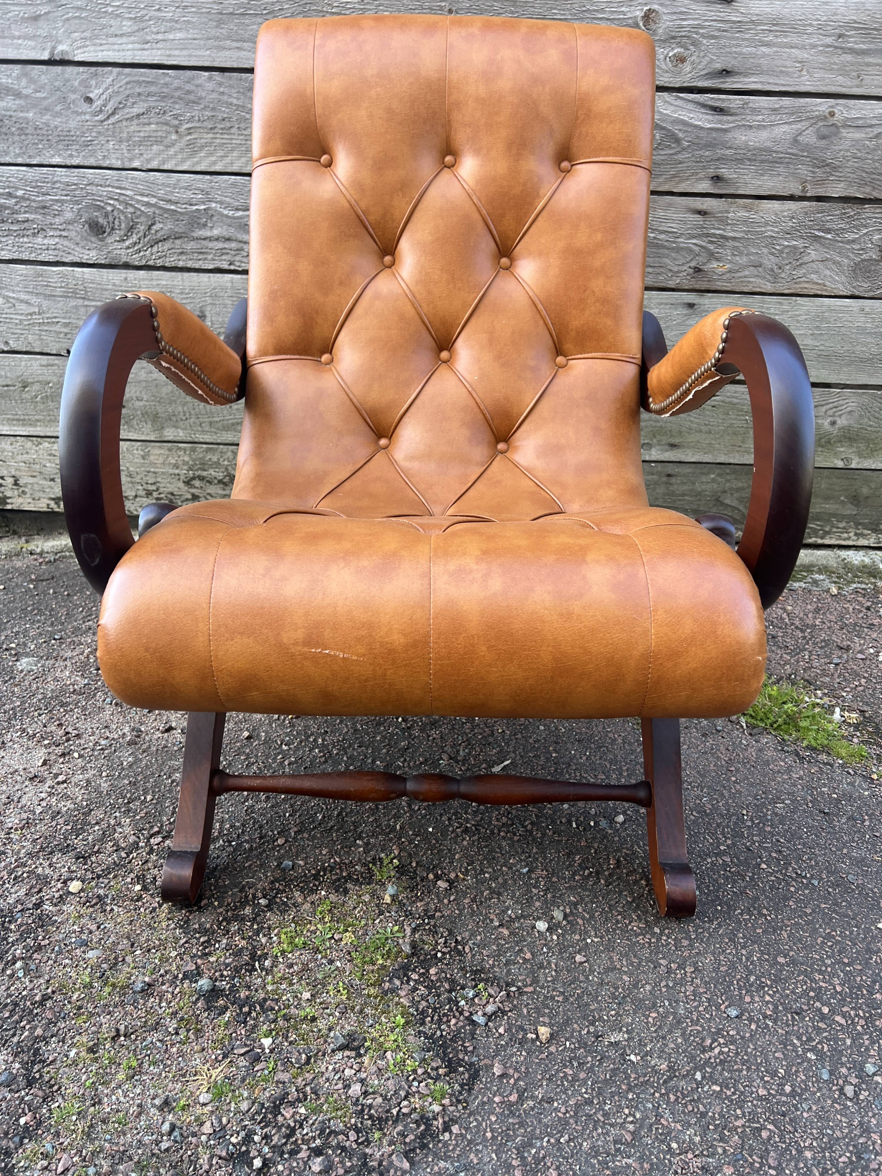Chesterfield leather slipper chair with mahogany