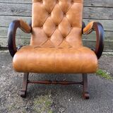Chesterfield leather slipper chair with mahogany