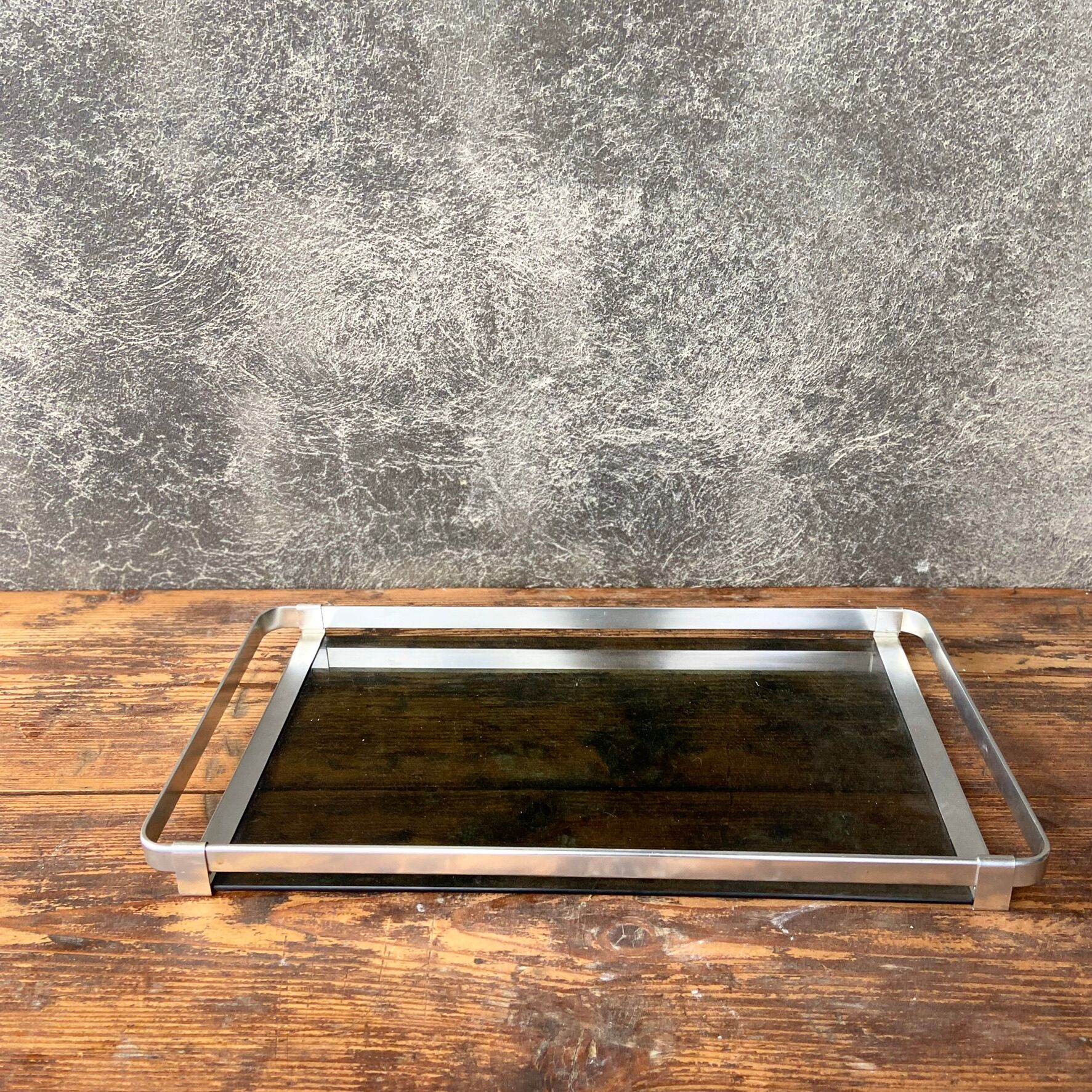 Top in smoked glass and steel