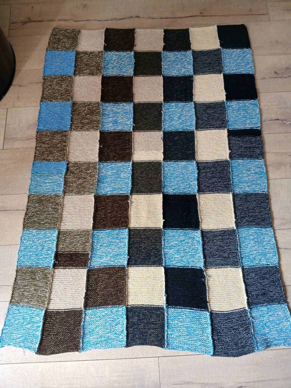 Hand knitted patchwork plaid