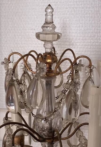 Candle holder or candelabrum with four arms of light.
