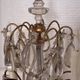 Candle holder or candelabrum with four arms of light.